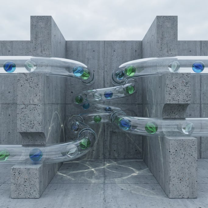 Glass marbles rolling through a transparent tube marble run, refraction and caustics everywhere