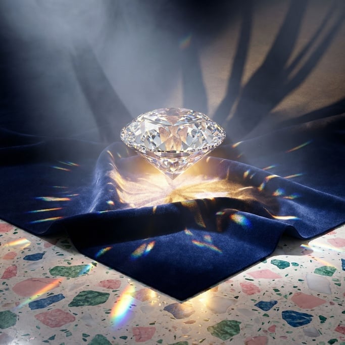 A single diamond hovering above dark velvet (jmtwrbtf)