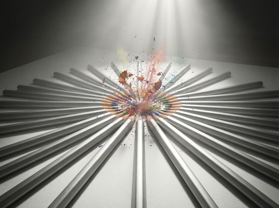 Pencils arranged in a radial sunburst pattern, tips meeting at center