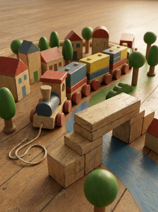 Wooden toy train set landscape — painted wooden buildings in simple shapes
