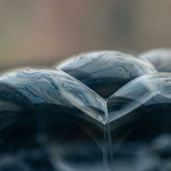 Macro shot of soap bubbles, iridescent surface tension and interference patterns (pvdnvf)