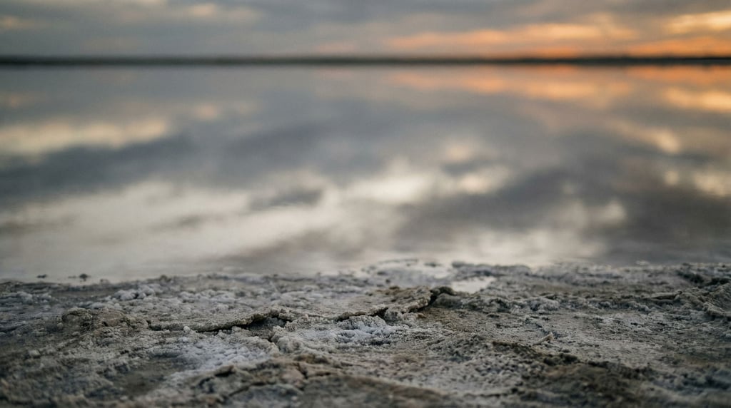 A salt flat at sunset, perfectly reflective surface mirroring clouds (5vcyiiw)