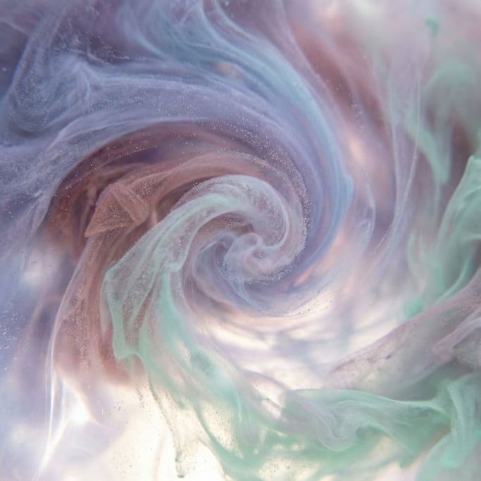 Ink dropped into water, tendrils expanding in slow motion, backlit from below (ye532hax)