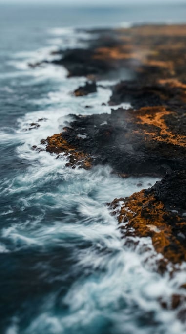 Ocean waves over black volcanic rock, long exposure turning water to silk (fdk6oqai)
