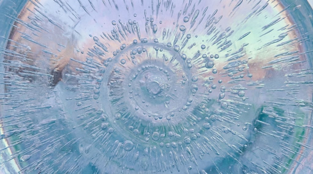 Frozen air bubbles trapped in clear blue ice, macro shot, cool crystalline tones (cwx9wga)