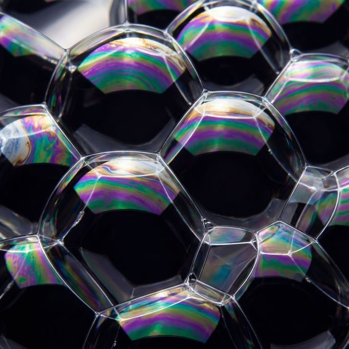 Iridescent soap-bubble spheres packed tight against each other