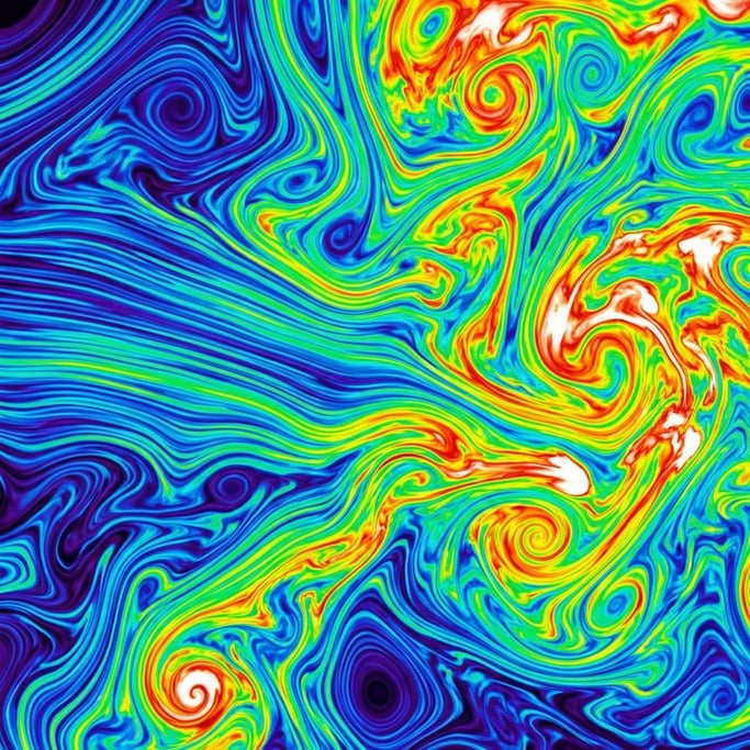 Swirling currents rendered in the false-color spectrum of thermal imaging — deep blue through green and yellow to bright red and white