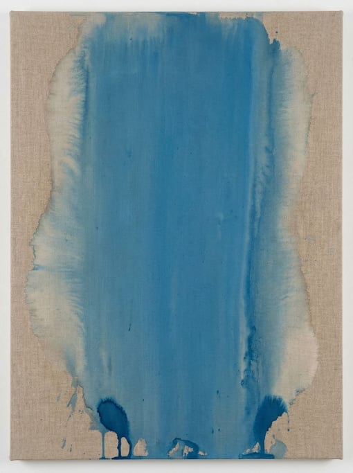 Cerulean blue paint soaks into raw unprimed canvas in a single dominant vertical pour — color field