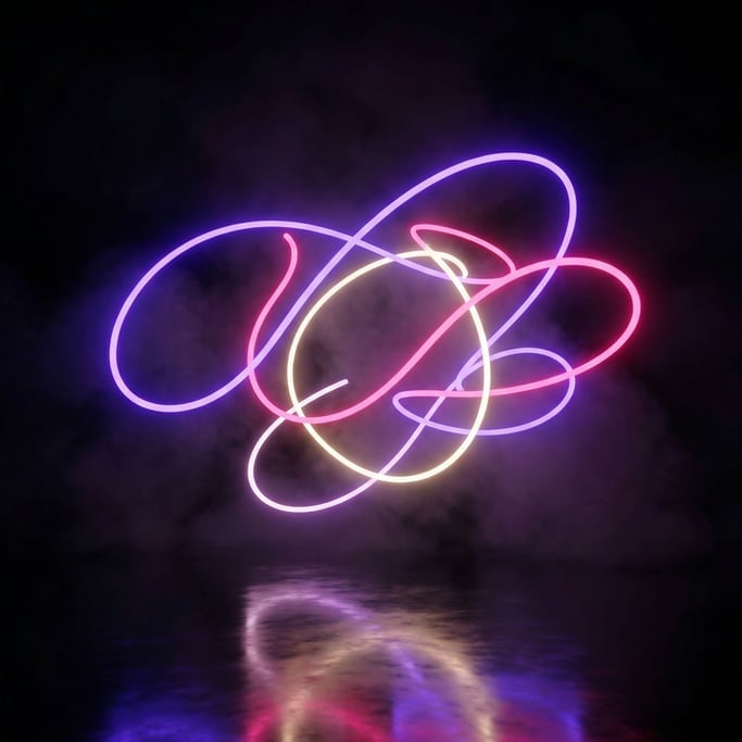 Neon tubes glow in electric violet and hot pink and warm white
