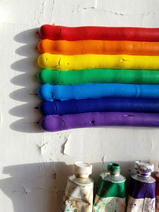 Rainbow sequence from top to bottom — thick ridges of dried acrylic paint squeezed directly from the tube in parallel horizontal lines