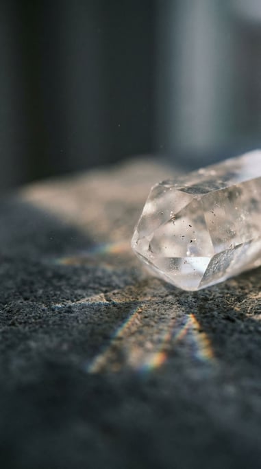 Light refracting through a crystal prism, rainbow caustics scattered across a dark surface (cgcwjc8e)