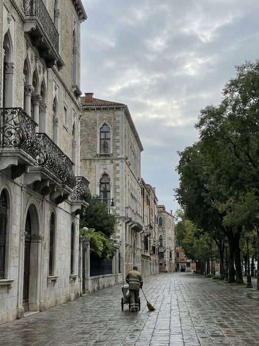 Grand Venetian Gothic boulevard with elaborate wrought-iron balcony railings with floral motifs