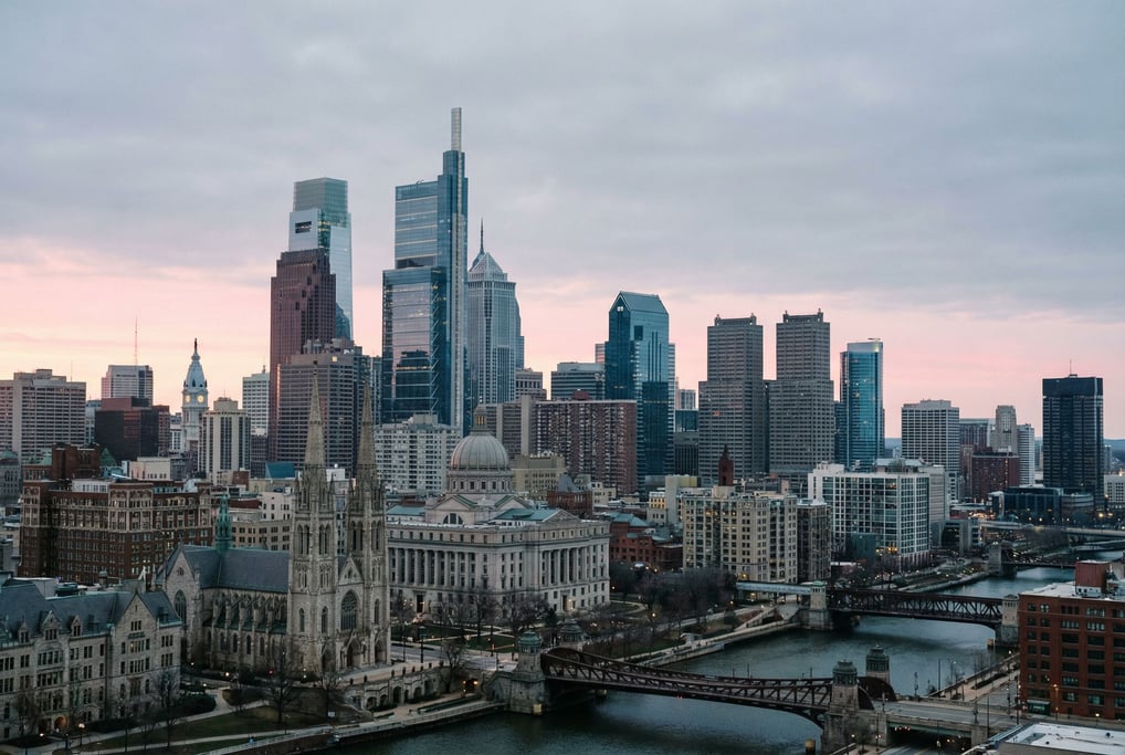 Sweeping panoramic view of a mixed historic and contemporary city skyline at dawn