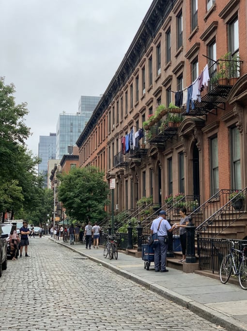 Row of brownstone townhouses in a modern neighborhood