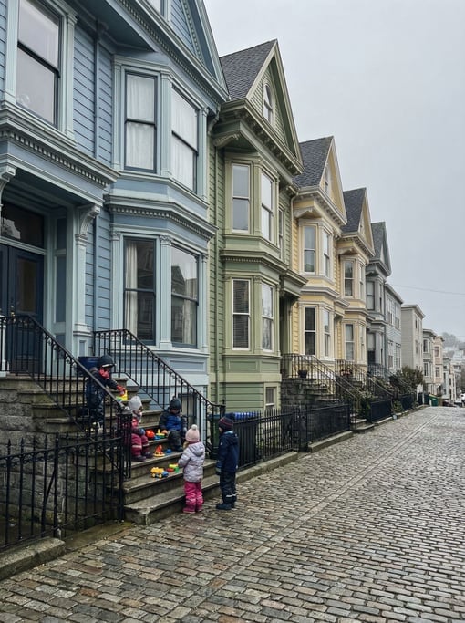 Victorian painted lady houses on a hill in a northern European neighborhood
