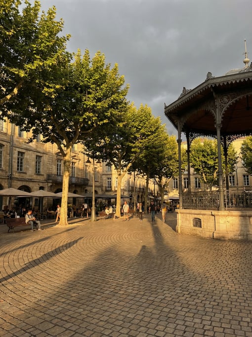 Tree-shaded plaza with a bandstand in a European city