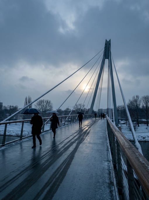 Modern cable-stayed pedestrian bridge in winter light