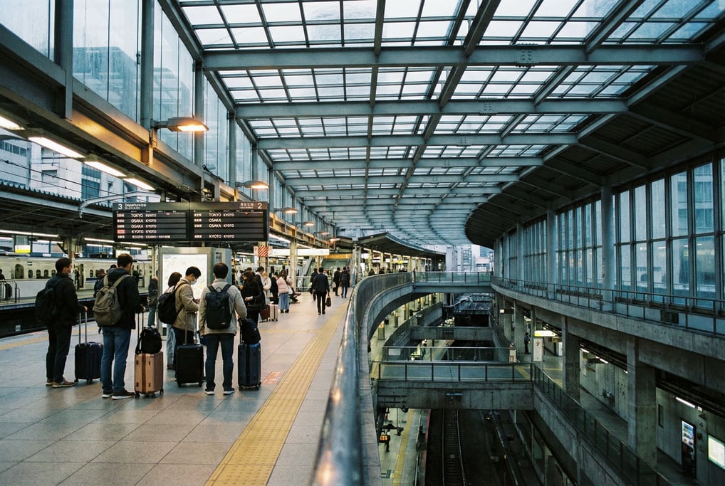 Elevated train platform, steel and glass canopy filtering daylight