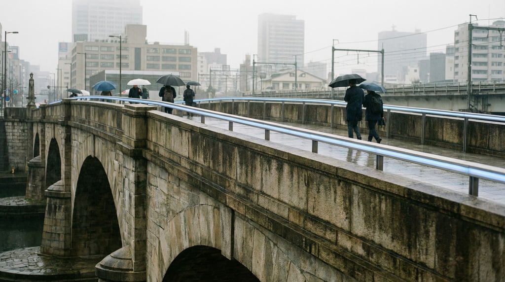 Historic stone arch bridge at overcast midday, LED handrail lighting glowing soft blue