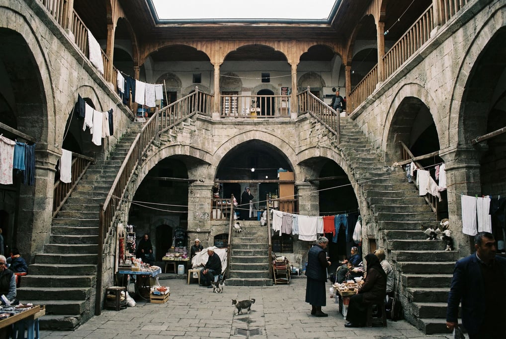 Looking up through a courtyard of a Ottoman-era caravanserai