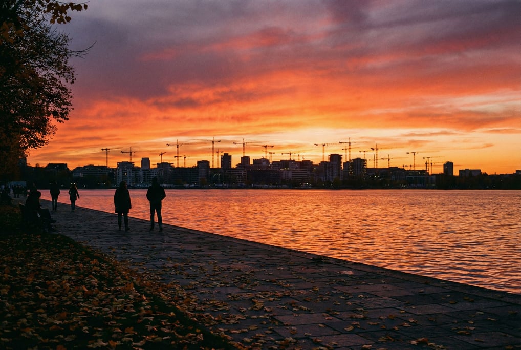 Distant city skyline seen from a lakeside promenade