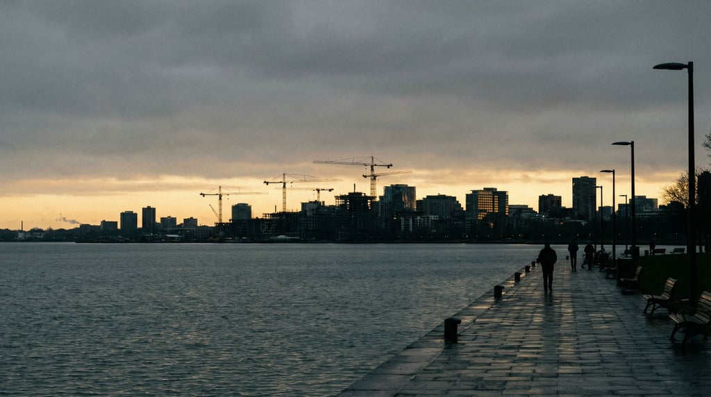 Distant city skyline seen from a lakeside promenade