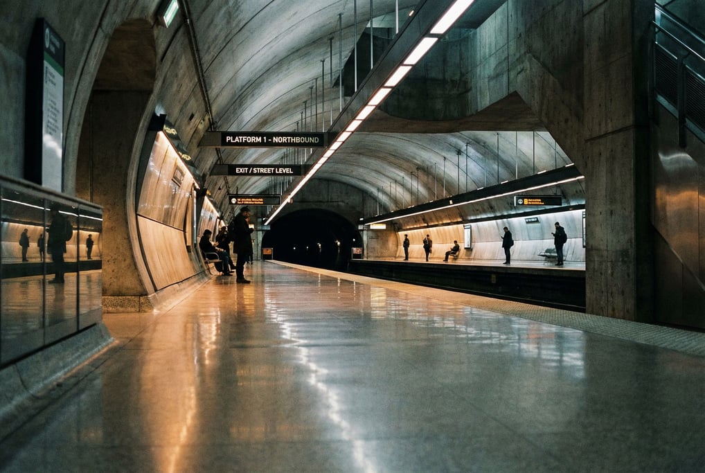 Underground metro station with a long curved platform