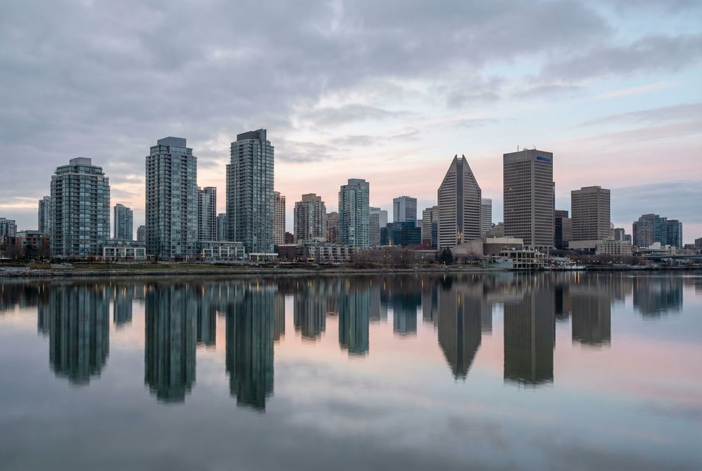 Postmodern city skyline reflected in a calm river at dawn
