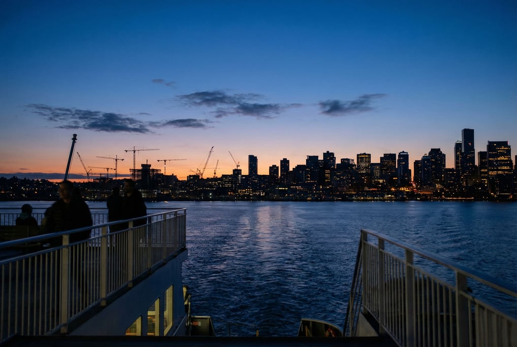 Distant city skyline seen from a ferry approaching the harbor