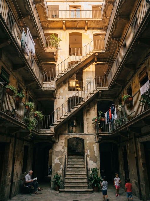 Looking up through a courtyard of a tall residential building