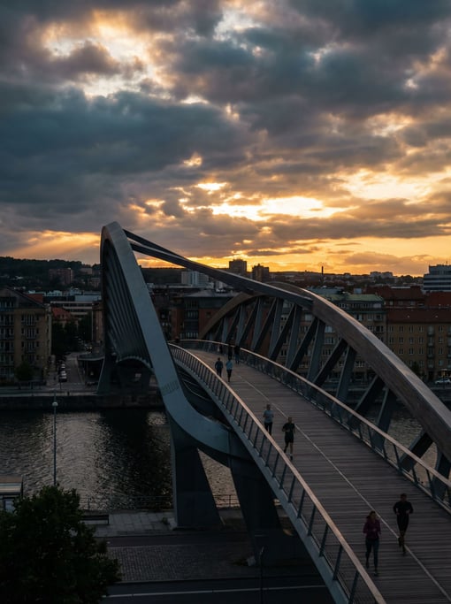Sleek contemporary cycling bridge under dramatic clouds