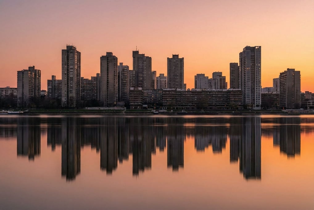 Brutalist concrete city skyline reflected in a calm river at sunset