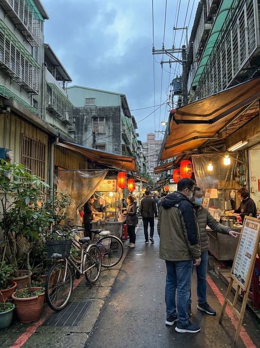 Narrow Taipei lane with street food stalls with potted plants and bicycles lining the narrow sidewal