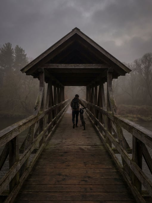 Covered wooden footbridge under overcast skies, soft even light and muted tones