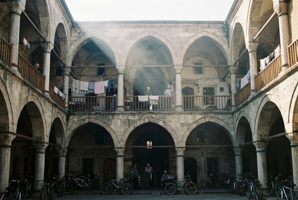 Looking up through a courtyard of a Ottoman-era caravanserai