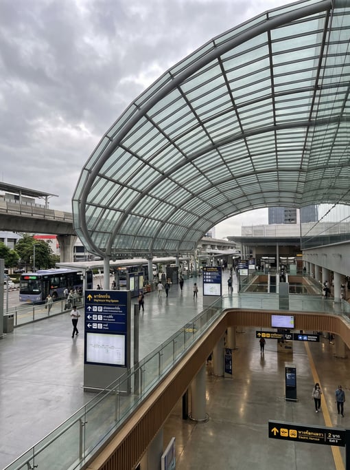 Modern transit hub with sweeping roof in a Bangkok