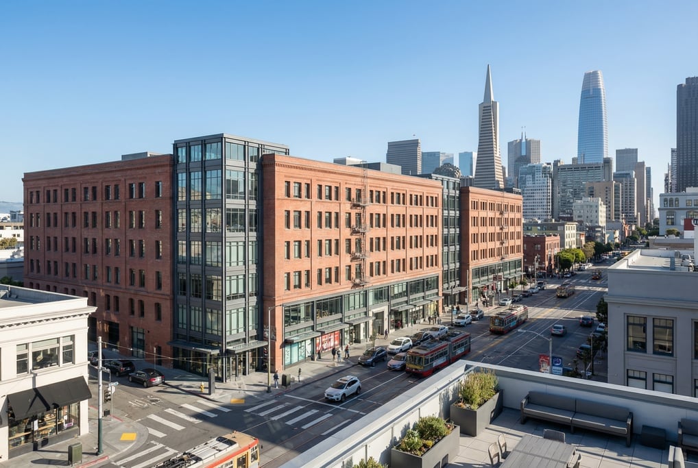Elevated view from a rooftop terrace overlooking a busy intersection in San Francisco on a bright cl