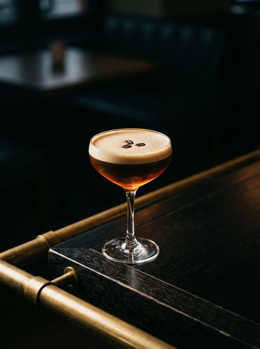 Tall vertical frame of an Espresso Martini in a coupe glass