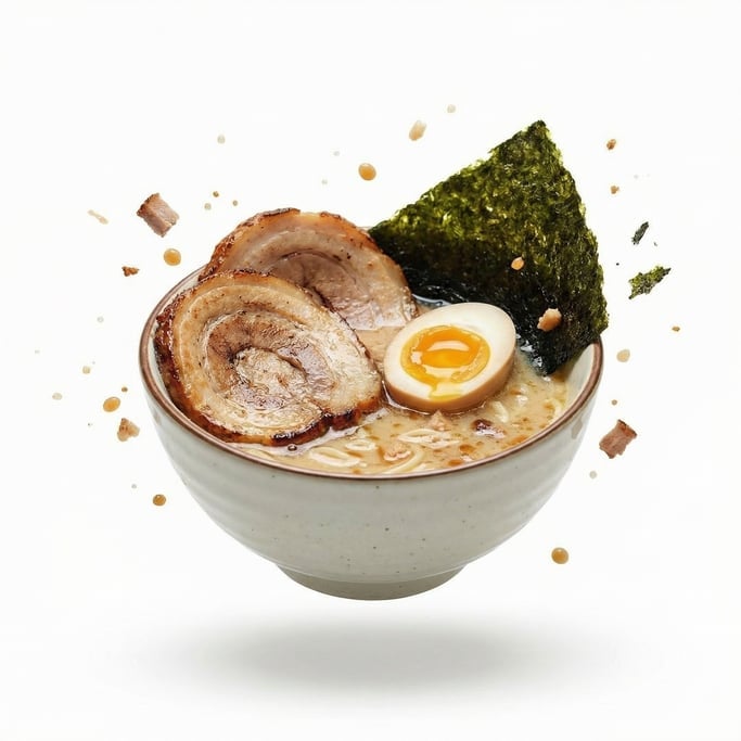A bowl of ramen with chashu pork, soft egg, and nori