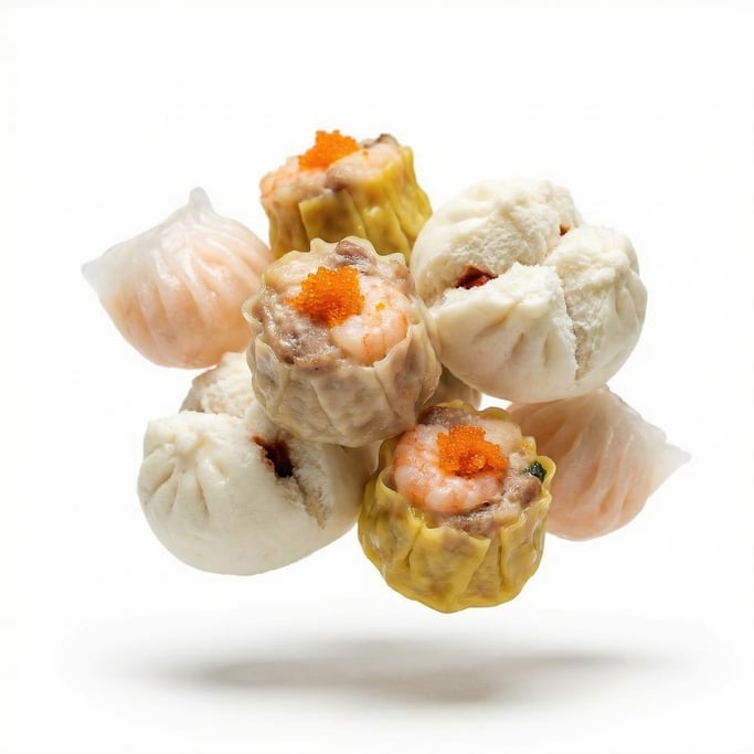 A plate of colorful dim sum dumplings — har gow, siu mai, and char siu bao