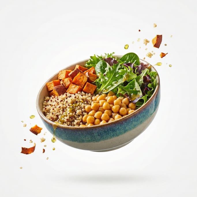 A colorful Buddha bowl with quinoa, chickpeas, sweet potato, and greens