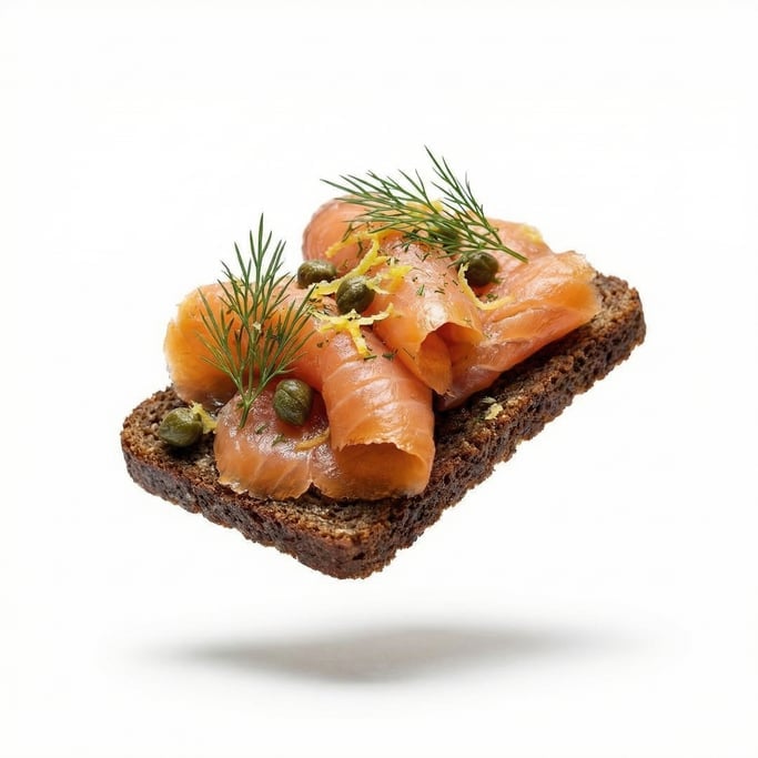 An open-faced smørrebrød with smoked salmon and dill on dark rye, floating in mid-air
