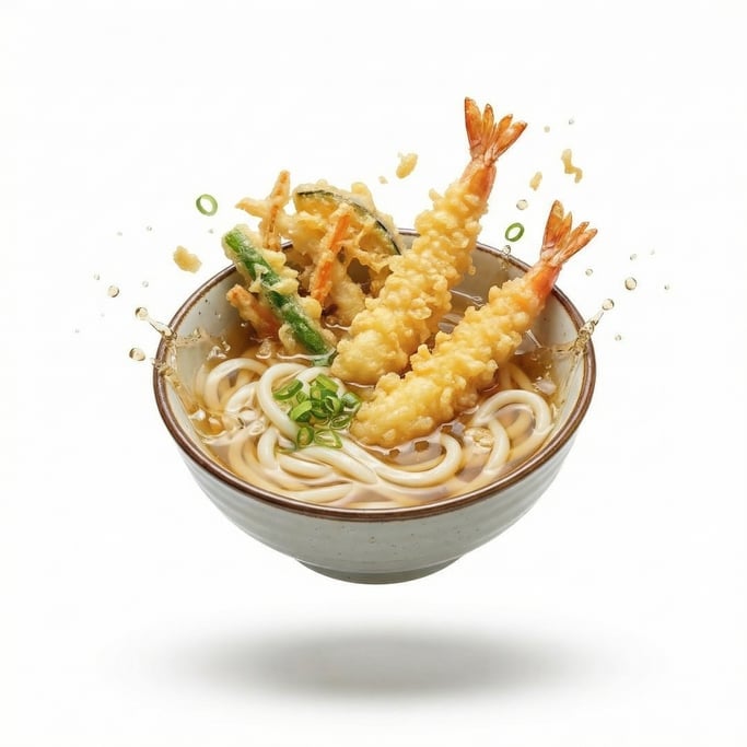 A bowl of Japanese udon noodles in clear dashi broth with tempura, floating in mid-air