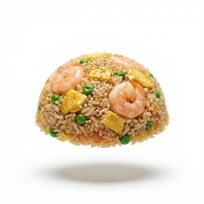 Fried rice with shrimp, egg, peas, and sesame seeds, floating in mid-air