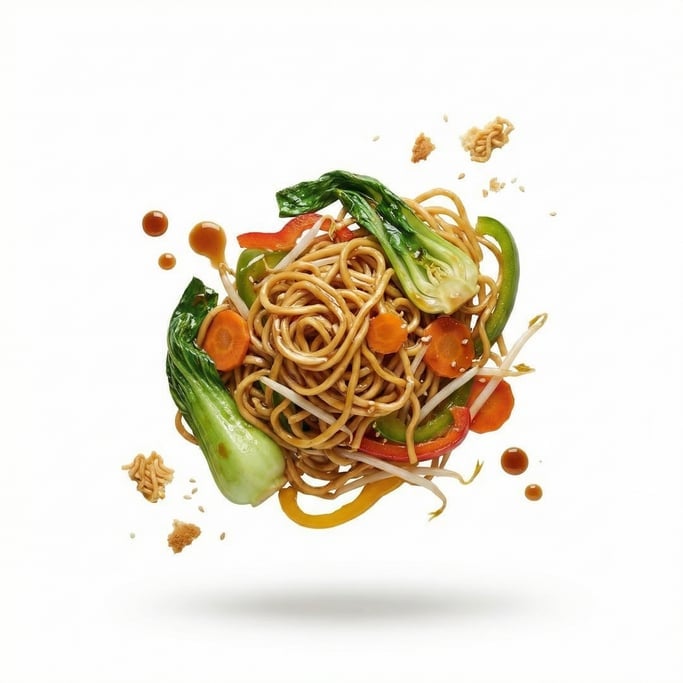 A plate of chow mein with vegetables and soy glaze