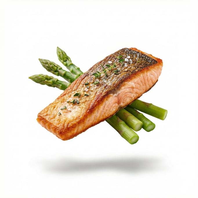 A plate of pan-seared salmon fillet with crispy skin and asparagus, floating in mid-air