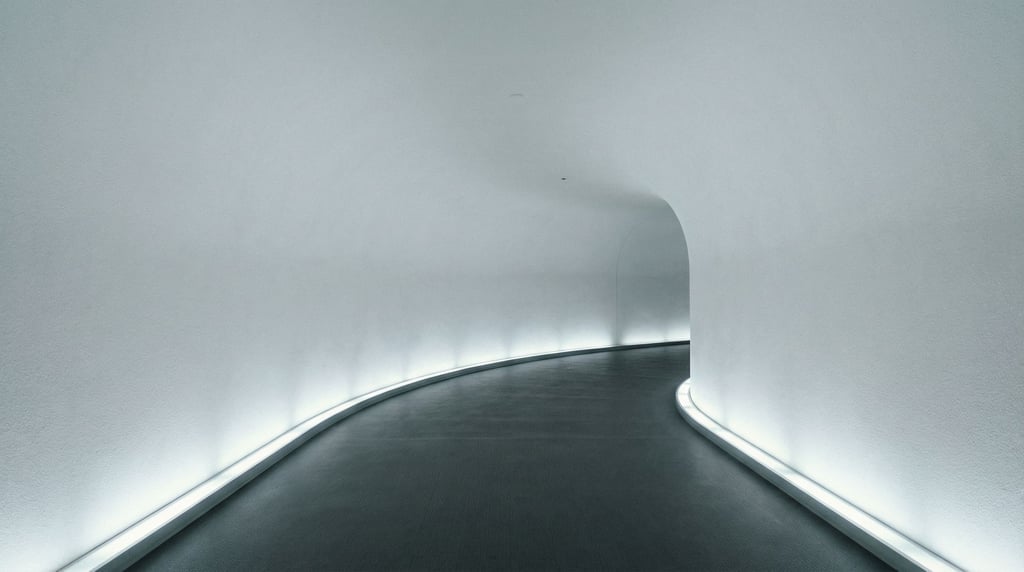 A liminal corridor that curves gently to the right