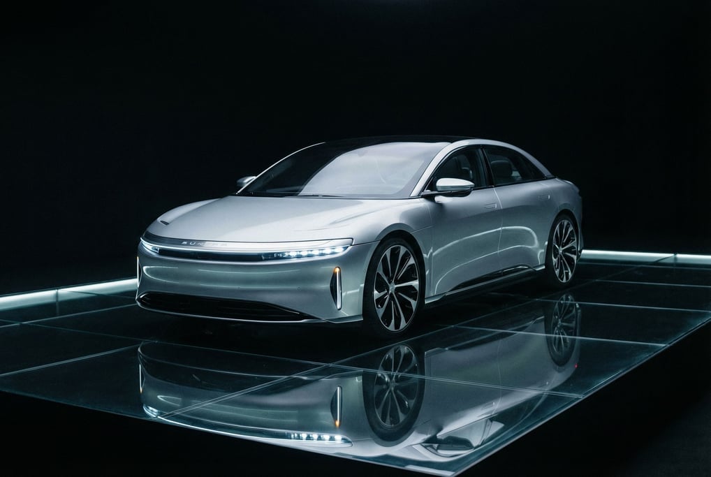 Front three-quarter view of a concept sedan in liquid silver paint