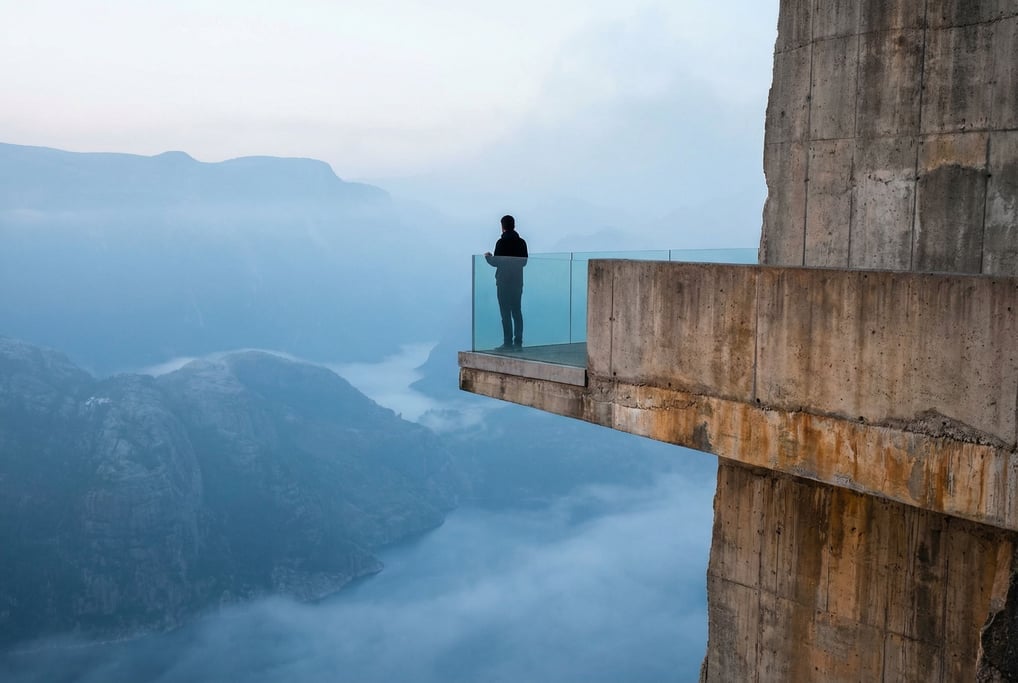 A cantilevered observation deck extending from a concrete cliff face