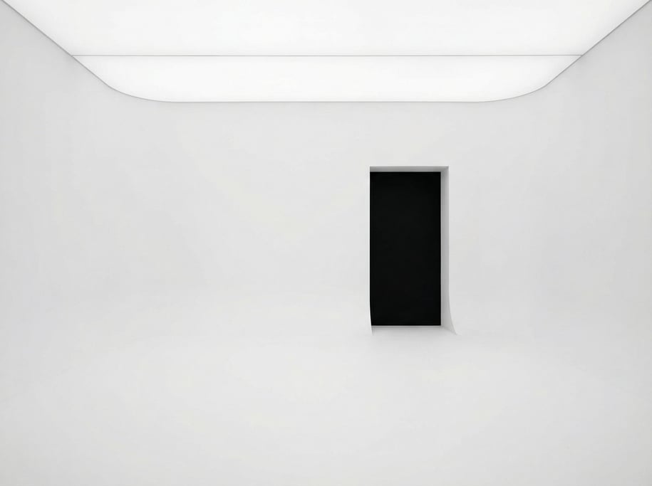 A seamless white room with curved walls meeting the floor and ceiling with no visible edges or corne